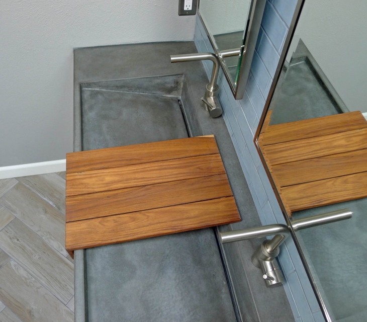 Concrete ramp sink with teak shelf