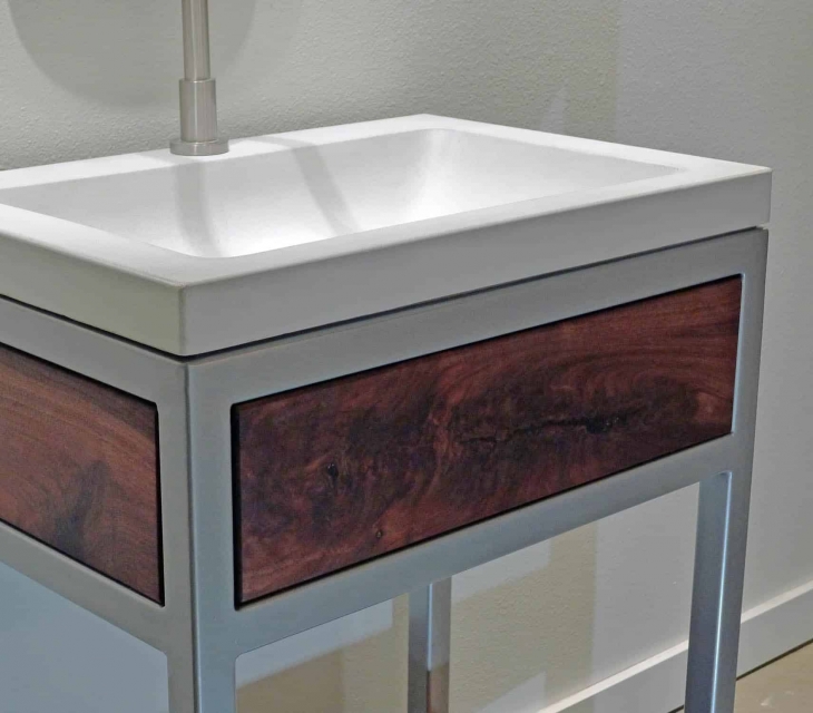 Concrete, steel,  and walnut vanity detail